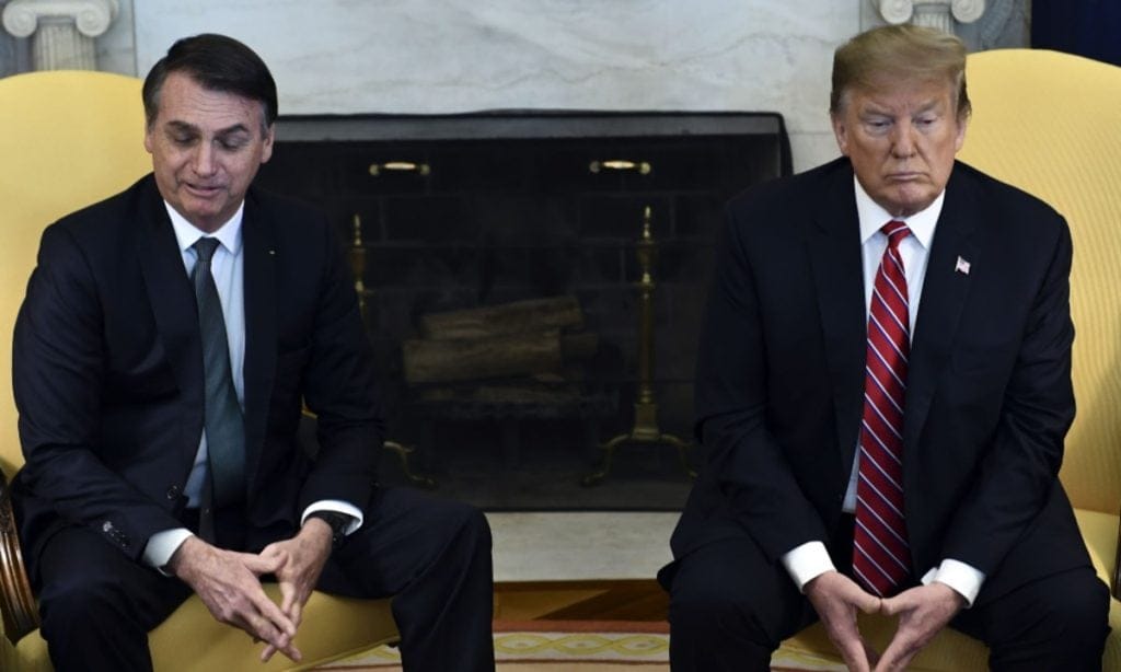 Tarifas ao Brasil revelam uso político do comércio e abrem nova frente de tensão 1 | Brazil Economy Jair Bolsonaro e Donald Trump em encontro nos EUA em 2019. Na ocaisão, Bolsonaro disse "I love you" para Trump